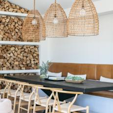 Scandinavian Dining Area With Firewood