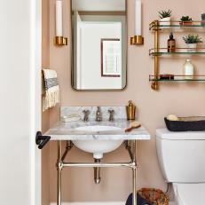 Pink Small Bathroom With Brass Shelf