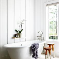 Bright Bathroom Features Shiplap and a Freestanding Tub With Chrome Fixtures