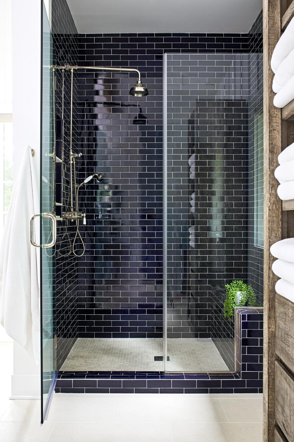 Walk-In Shower Features Black Subway Tile, Chrome Fixtures and a Built ...