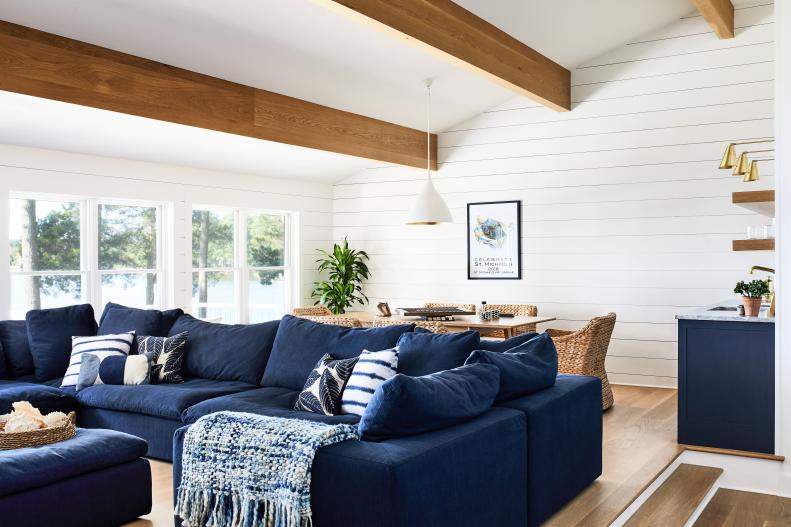Neutral Living Room Features Exposed Beams and a Shiplap Accent Wall