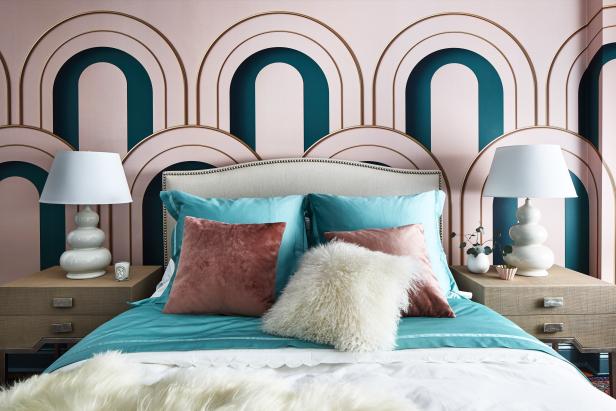 An Art Deco interior design bedroom with geometric patterns and bold  colors. The walls are painted