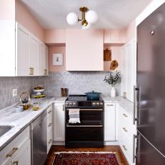 Gold and Black Stainless Accents for a Tiny Kitchen in Pink, White and Gray