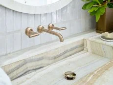 Striped onyx creates a dramatic sink in a master bathroom. 
