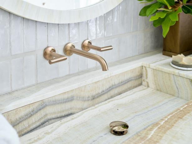 Striped onyx creates a dramatic sink in a master bathroom. 