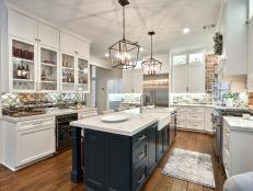 White Cabinets and a Large Kitchen Island Accent an Open Plan Kitchen