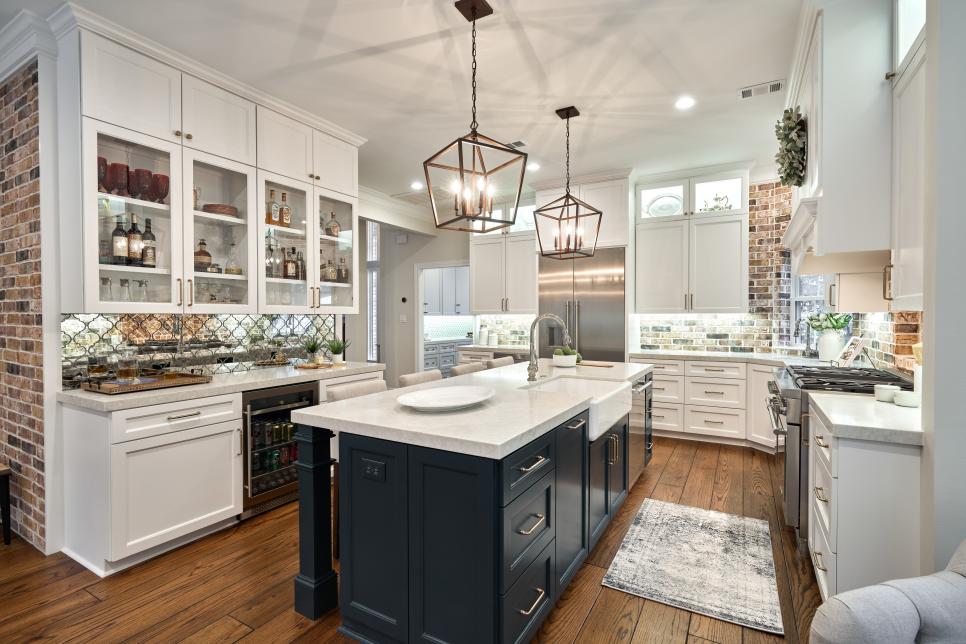 White Cabinets and a Large Kitchen Island Accent an Open Plan Kitchen