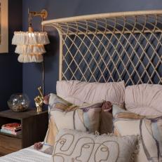 Navy Bedroom With Curved Rattan Bed