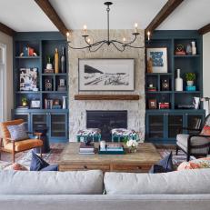 Transitional Living Room With Blue Bookshelves