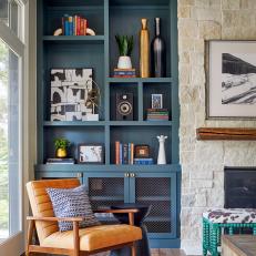 Armchair and Blue Built-In Shelf