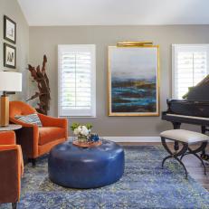 Transitional Music Room With Orange Chairs