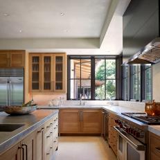Neutral Contemporary Chef Kitchen With Corner Windows