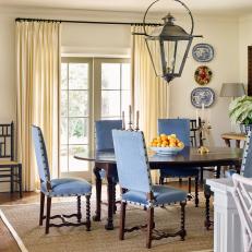 Traditional Dining Room With Blue Velvet Chairs