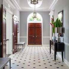 Traditional Foyer With Arched Window