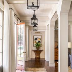 Entryway Lighted by Rustic Lanterns 