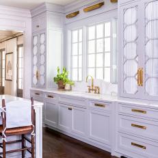 Gray and White Kitchen With Ornate Cabinetry