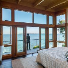 Waterfront Contemporary Bedroom With Balcony