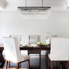 Transitional Dining Room With Crystal Chandelier