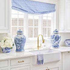 Blue and White Cottage Kitchen With Urns