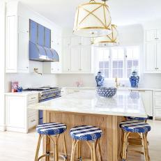 Blue and White Cottage Kitchen With Woven Stools