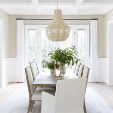 Neutral Transitional Dining Room With Leaf Arrangements