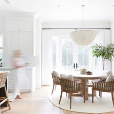 White Transitional Dining Area With Round Rug