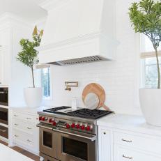 White Transitional Kitchen With Round Cutting Boards