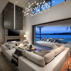 Gray Modern Living Room With Nighttime Lake View
