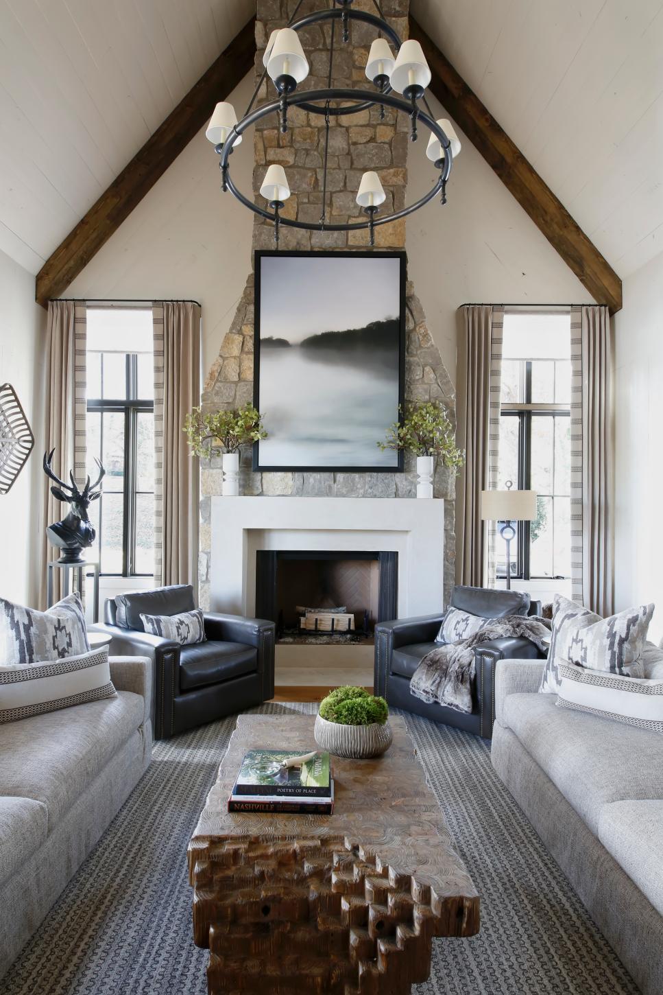 fireplace vaulted living ceilings limestone hgtv chandelier wrought features iron paige rumore