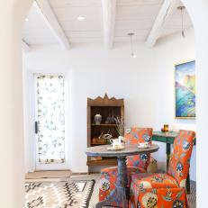 Eclectic Sitting Area With Orange Chairs