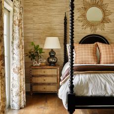 Traditional Coastal Bedroom with Black Four-Poster Bed and Grass Cloth 