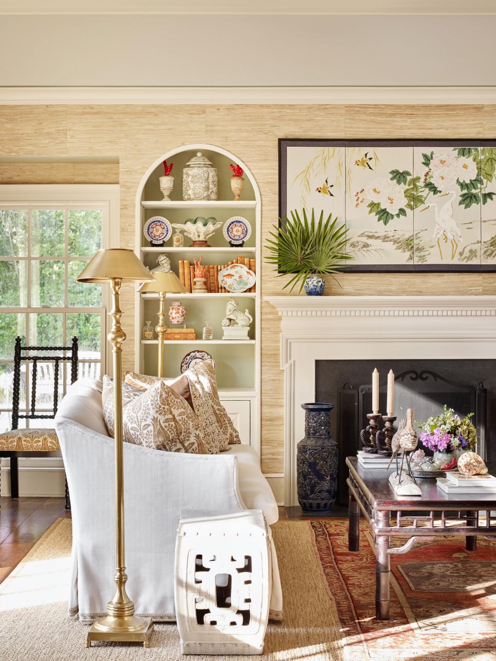 traditional coastal living room on Traditional Coastal Living Room With Grass Cloth Built In Shelves And White Sofas Hgtv