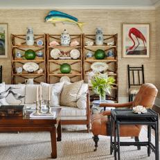Living Room with Bird Prints and Open Bamboo Shelves with Traditional and Coastal Antiques 