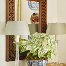 Carved Mirror with Glass Table Lamps and Indoor Plant in Vase