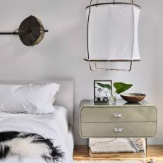 Eclectic Master Bedroom With Green Nightstand