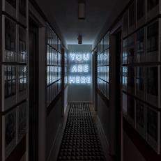 Hallway With Neon Sign