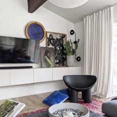 Eclectic Living Room With Black Chair