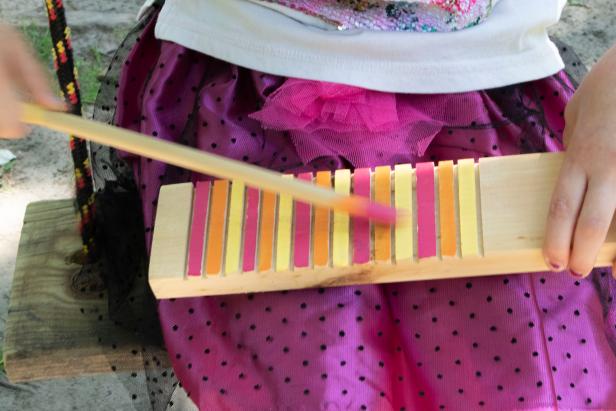 A DIY wooden block toy with textures for a musical experience.