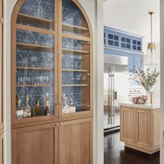 Arched Kitchen Cabinet With Blue Tiles