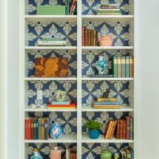 Bookshelf With Blue Wallpaper
