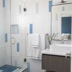 Blue and White Main Bathroom With Floating Vanity