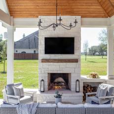 Covered Patio With Outdoor Limestone Fireplace