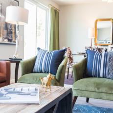 Green Velvet Armchairs and Blue Pillows