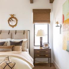 Neutral Mediterranean Bedroom With Gold Mirror