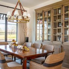 Neutral Transitional Dining Room With China Cabinet