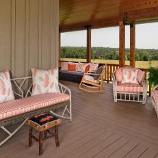 Wraparound Porch With Ample Seating and Countryside Views