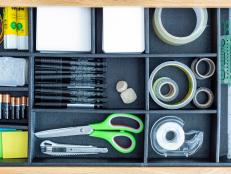 With a little creativity, you can turn leftover shipping boxes and vinyl shelf liner into a custom organizer to tame desk drawer clutter once and for all.