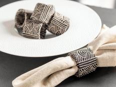 Upcycle an empty paper towel tube and a bit of leftover fabric into a fashion-forward accessory for your dining table.
