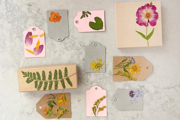HGTV Handmade’s Liz Gray shares how to make pressed flowers gift tags. To make, you will need gift boxes, thick paper gift tags, decoupage glue, pressed flowers and a paint brush.