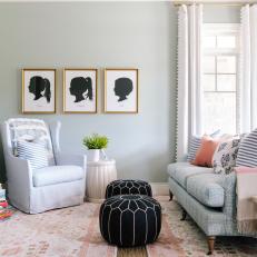 Gray Cottage Sitting Room With Black Ottomans